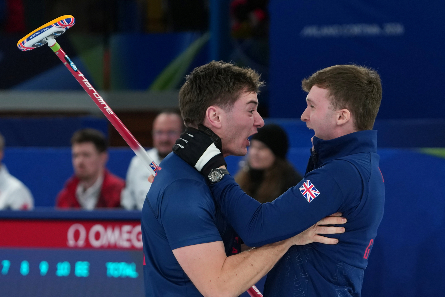 Britain's Grant Hardie and Bruce Mouat react after beating Switzerland in a men's curling semifinal match at the 2026 Winter Olympics, in Cortina, Italy, on Feb. 19. [AP/YONHAP]