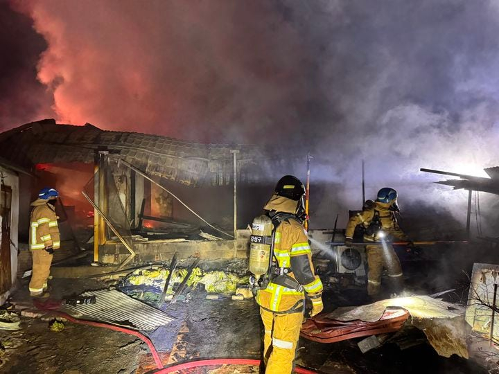 Firefighters put out a fire in this undated file photo. [JEONBUK FIRE SERVICE]