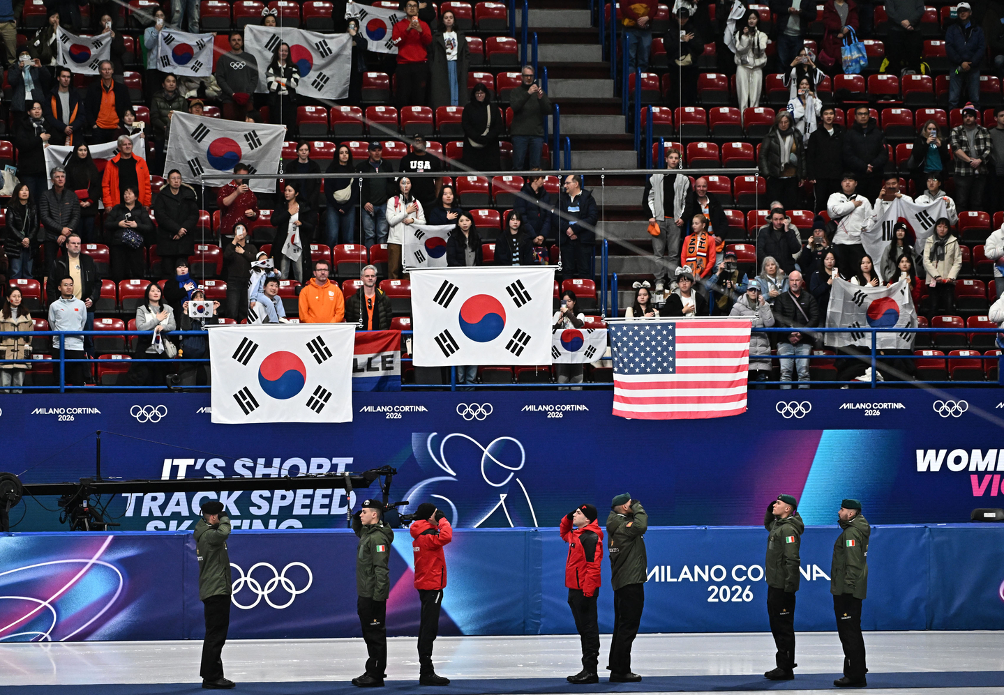 The correct version of Korea's national flag are raised during the medal ceremony for the women’s 1,500 meters short track speed skating medal ceremony at the 2026 Winter Olympics at Milano Ice Skating Arena in Italy on Feb. 20. [JOONGANGILBO]