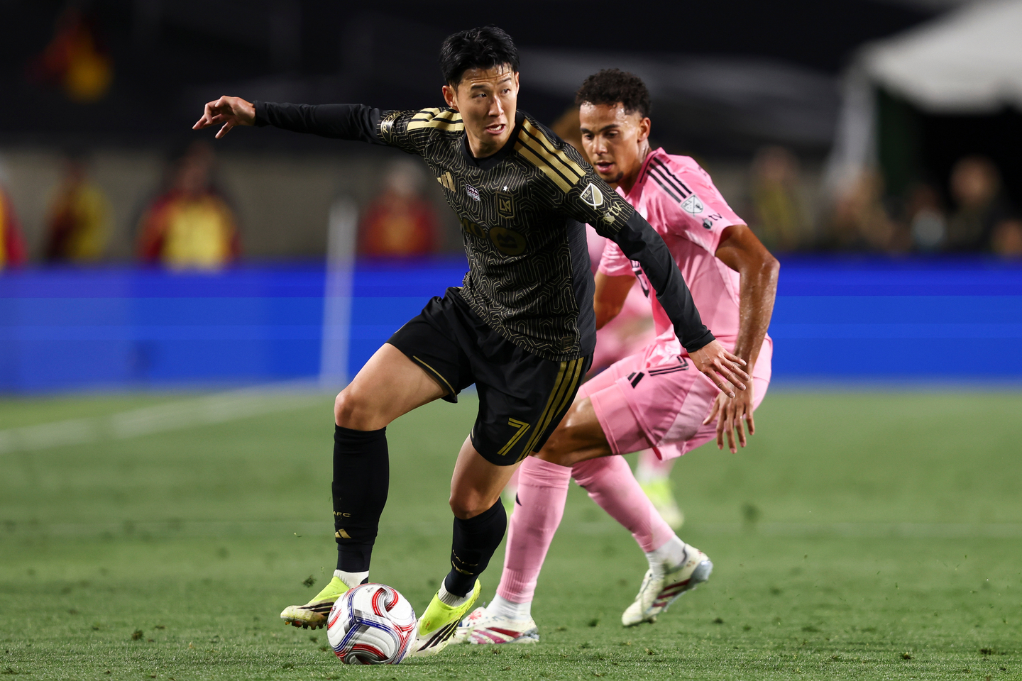 Los Angeles FC forward Son Heung-Min dribbles against Inter Miami defender Ian Fray during the first half of an MLS match in Los Angeles on Feb. 21. [AP/YONHAP] 