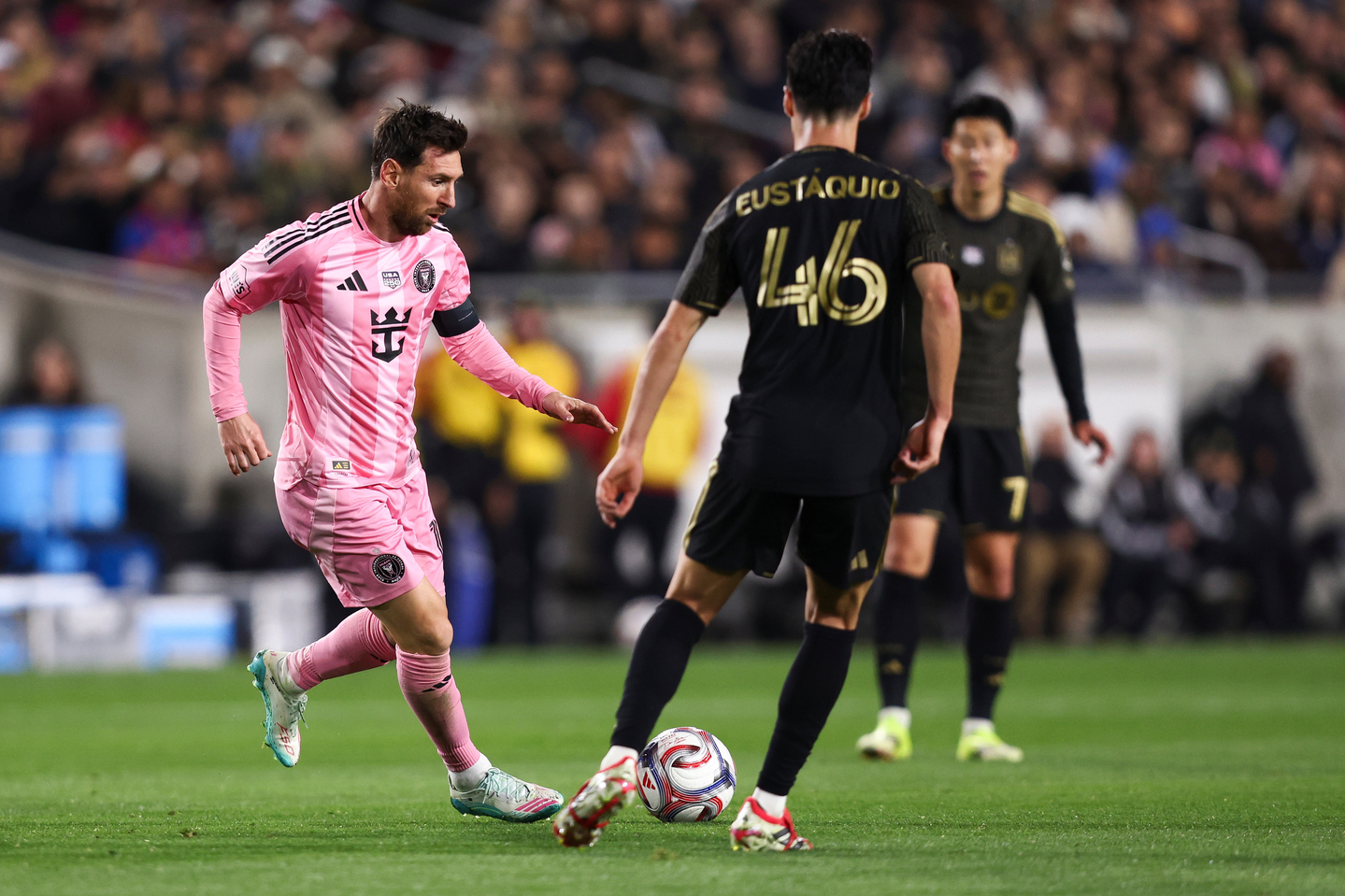 Inter Miami forward Lionel Messi, left, dribbles the ball during an MLS match against Los Angeles FC in Los Angeles on Feb. 21. [AP/YONHAP]