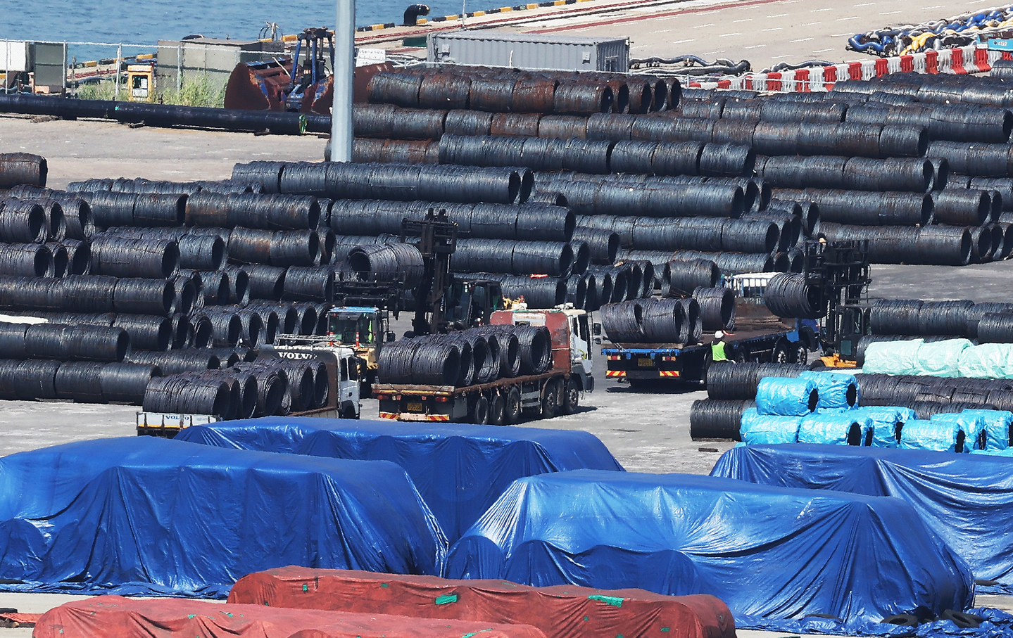 This file photo taken on Aug. 24, 2025, shows steel products piled up at a port in Pyeongtaek. [YONHAP] 