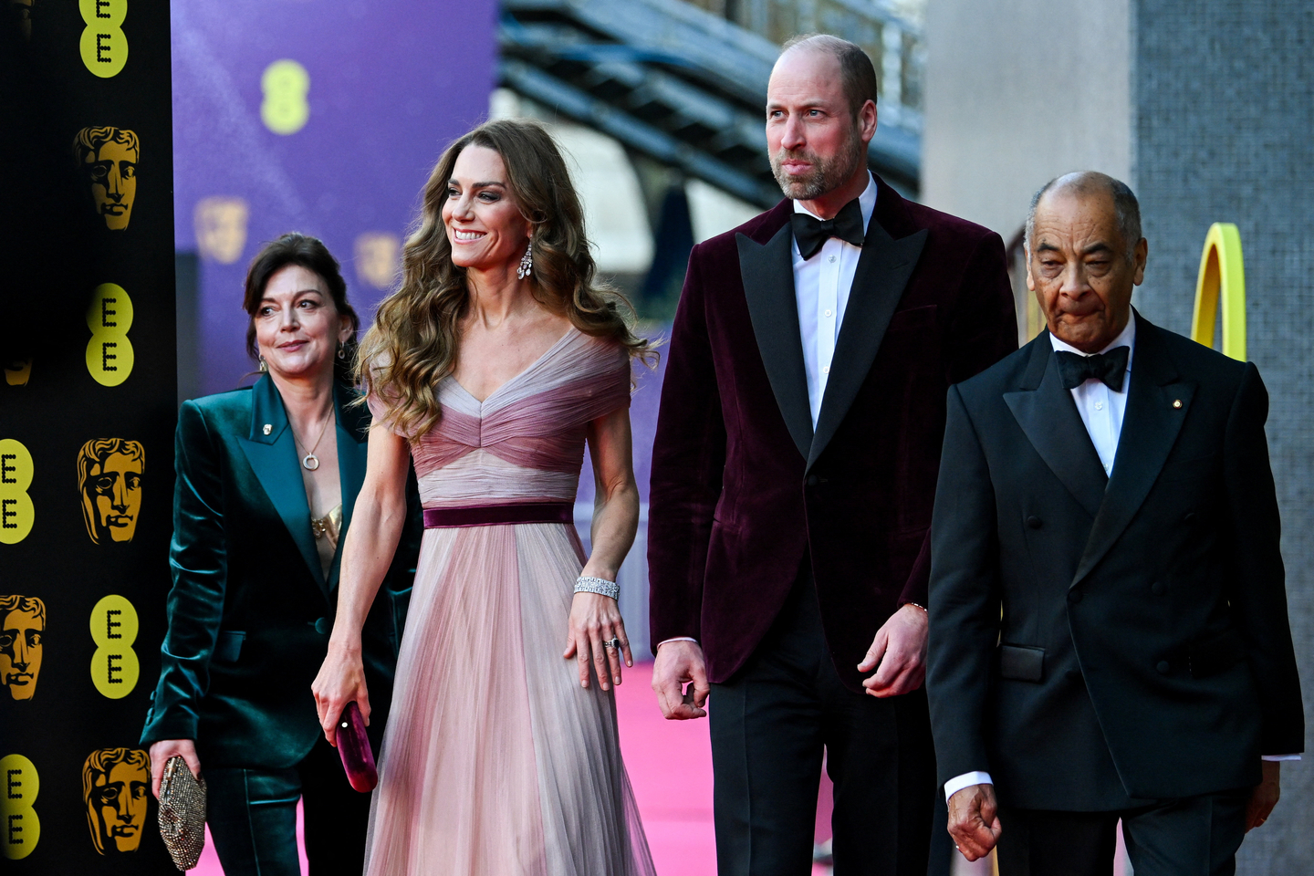 Britain's Prince William and Kate, Princess of Wales arrive with Jane Millichip, CEO of the British Academy of Film and Television Arts and Lord-Lieutenant of Greater London Ken Olisa to the 79th British Academy Film Awards, at the Royal Festival Hall, in London, on Feb. 22. [AP/YONHAP]