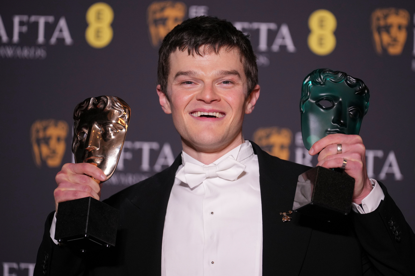 Robert Aramayo poses with the EE rising star award and the award for leading actor for ″I Swear″ (2025) at the 79th British Academy Film Awards in London, on Feb. 22. [AP/YONHAP]