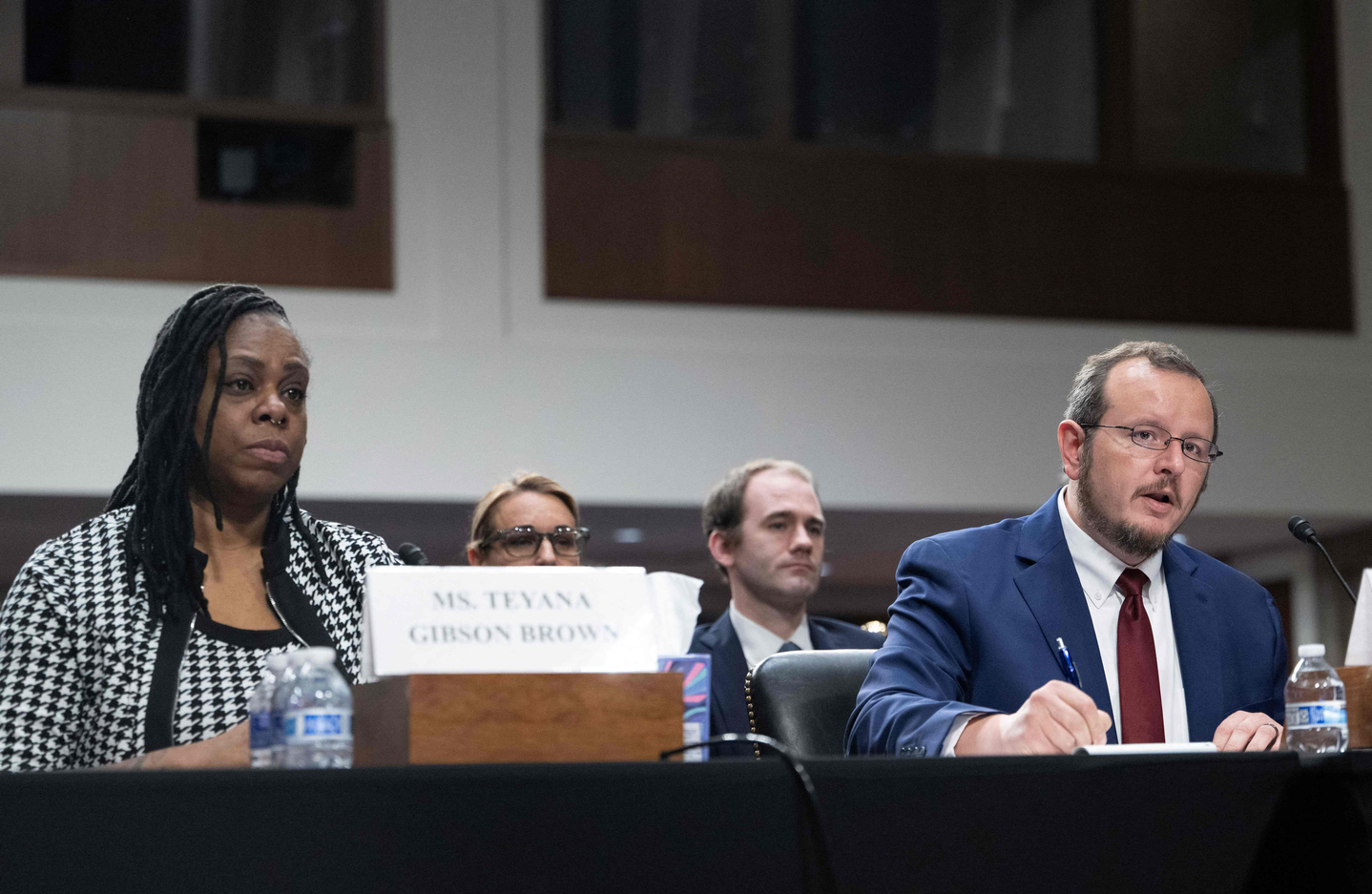 Former U.S. Immigration and Customs Enforcement instructor responsible for educating new ICE officers, Ryan Schwank, speaks as Teyana Gibson Brown, left, looks on during a forum on Immigration and Customs Enforcement (ICE) at the Dirksen Senate Office Building at the U.S. Capitol on Feb. 23 in Washington. [AFP/YONHAP]
