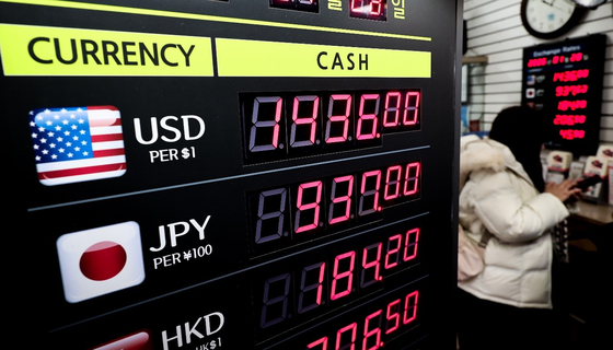 The dollar-won exchange rate is displayed on a screen at a currency exchange in Myeong-dong, Jung District, central Seoul, on Jan. 28. [NEWS1]