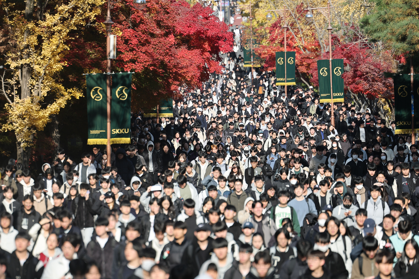 Students exit a testing site after completing the early admission essay exam for the 2026 academic year at Sungkyunkwan University in Jongno District, central Seoul, on Nov. 16, 2025. [YONHAP]