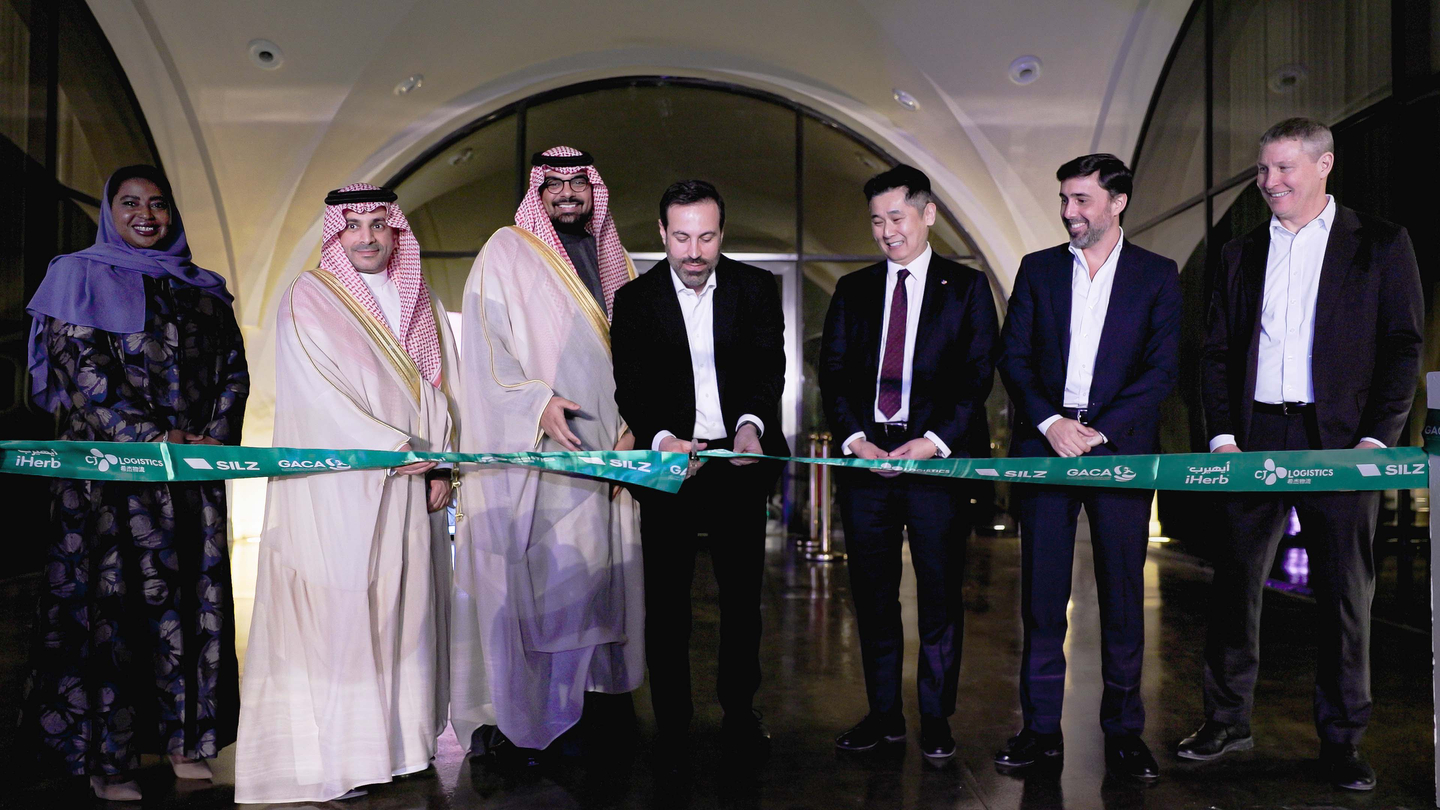 Emun Zabihi, CEO of iHerb, fourth from left, Jonathan Song, head of global business at CJ Logistics, fifth from left, along with representatives from the Saudi General Authority of Civil Aviation and the Riyadh Integrated Logistics Zone, participate in a ribbon-cutting ceremony to commemorate the grand opening of the Saudi Global Distribution Center on Feb. 12. [CJ LOGISTICS]