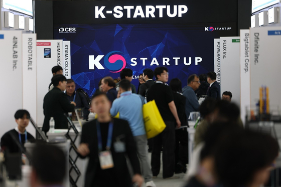 Visitors walk near a booth for Korean startups at the CES tech show is set up at the Venetian Expo in Las Vegas, Nevada, on Jan. 7. [YONHAP] 