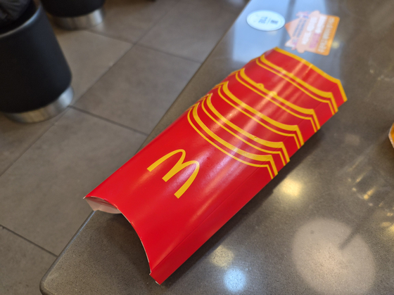 Empty french fry sleeves stacked during a spontaneous gathering at a McDonald’s branch in Gangnam District, southern Seoul, on Feb. 11 [CHO JUNG-WOO] 