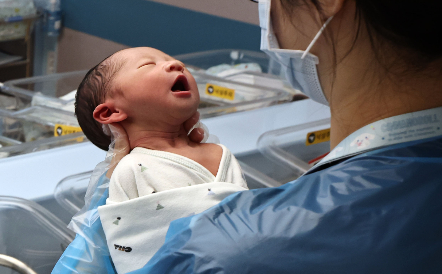 A nurse cares for a newborn at a hospital in Goyang, just west of Seoul, on Dec. 26, 2025. [YONHAP] 