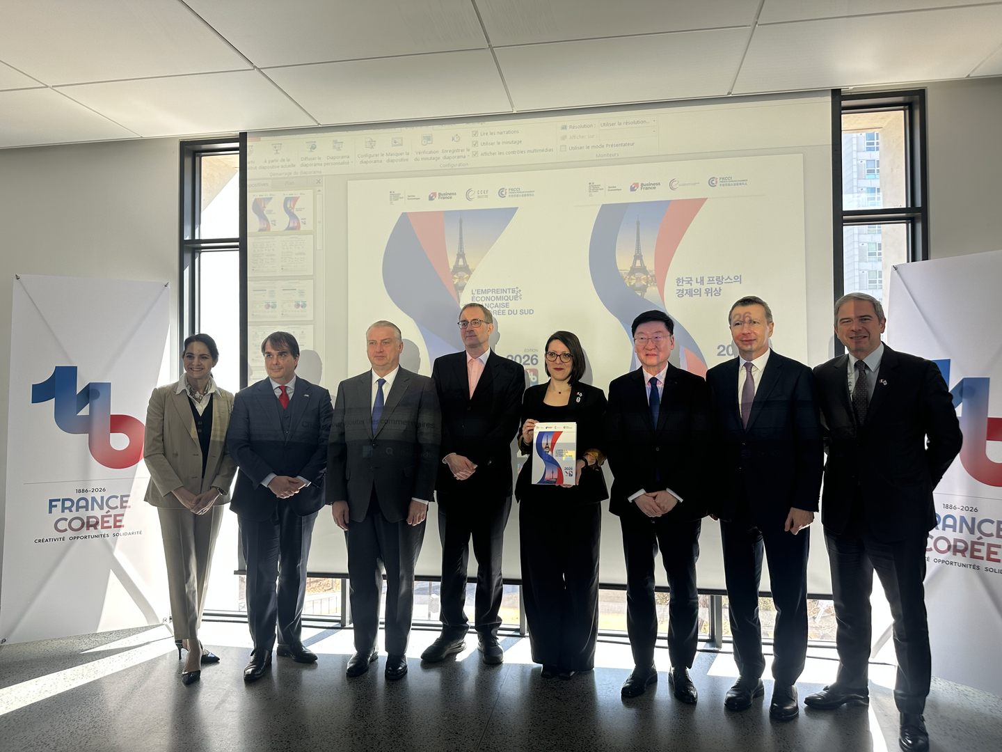 Participants of "Team France Korea" pose for a commemorative photo during a press briefing on a study regarding France’s economic footprint in Korea, marking the 140th anniversary of diplomatic ties between the two nations, held at the French Embassy in western Seoul on Feb. 25. [SEO JI-EUN]