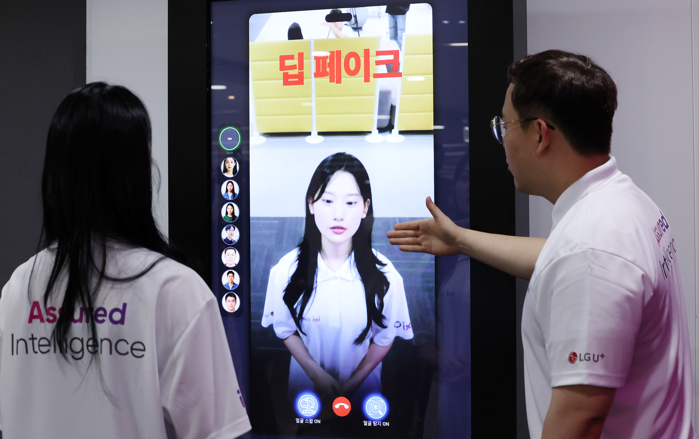 Models demonstrate LG Uplus’s AI anti-deepfake technology during an AI security technology briefing at the LG building in central Seoul on June 26, 2025. [NEWS1] 