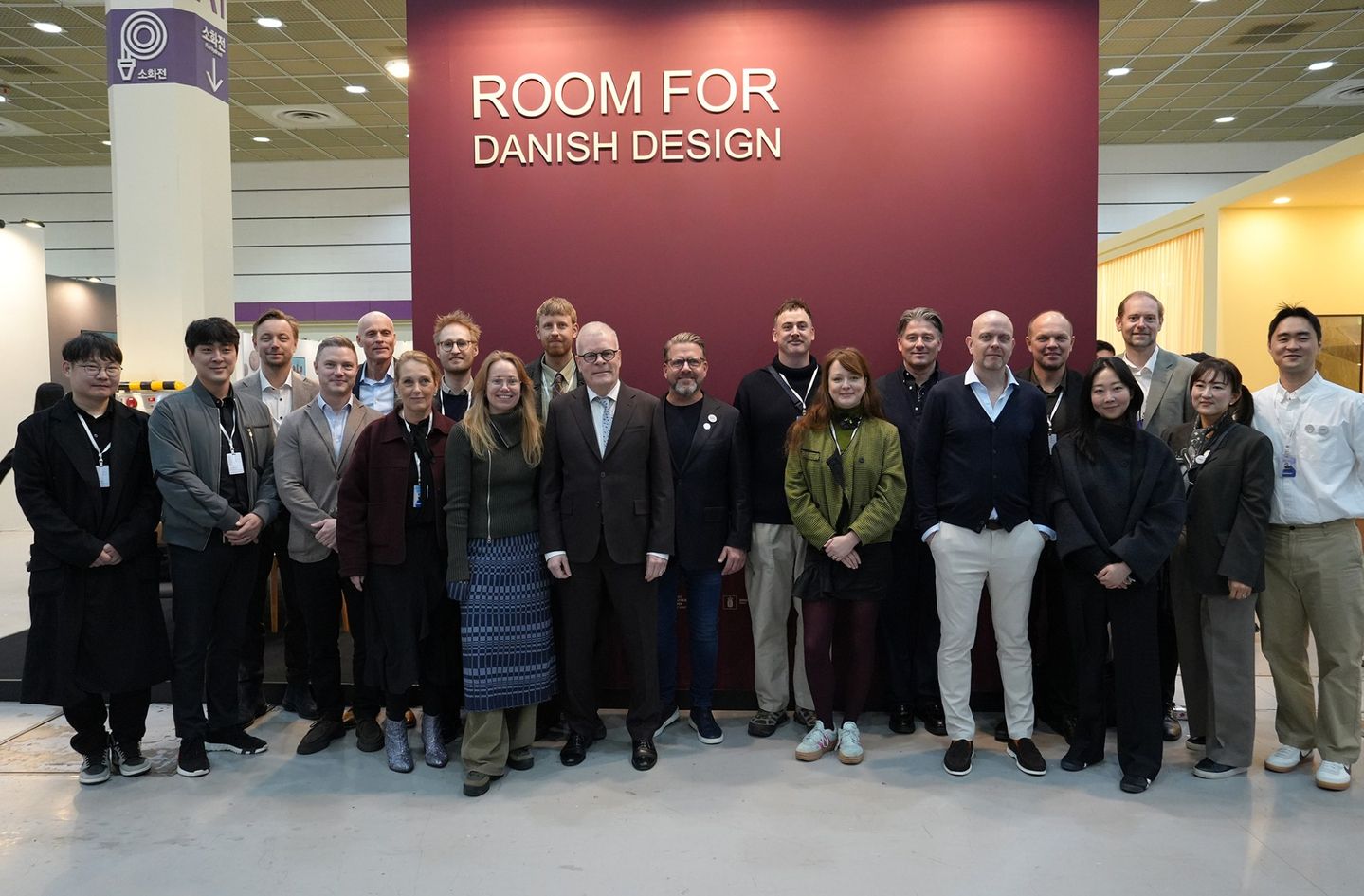 The Ambassador of Denmark to Korea, Mikael Hemniti Winther, front row center, stands with Danish Embassy staff and representatives from the 10 Danish brands attending the Danish Pavilion, at the 2026 Seoul Living Design Fair at Coex in southern Seoul on Feb. 25.  [EMBASSY OF DENMARK IN KOREA]