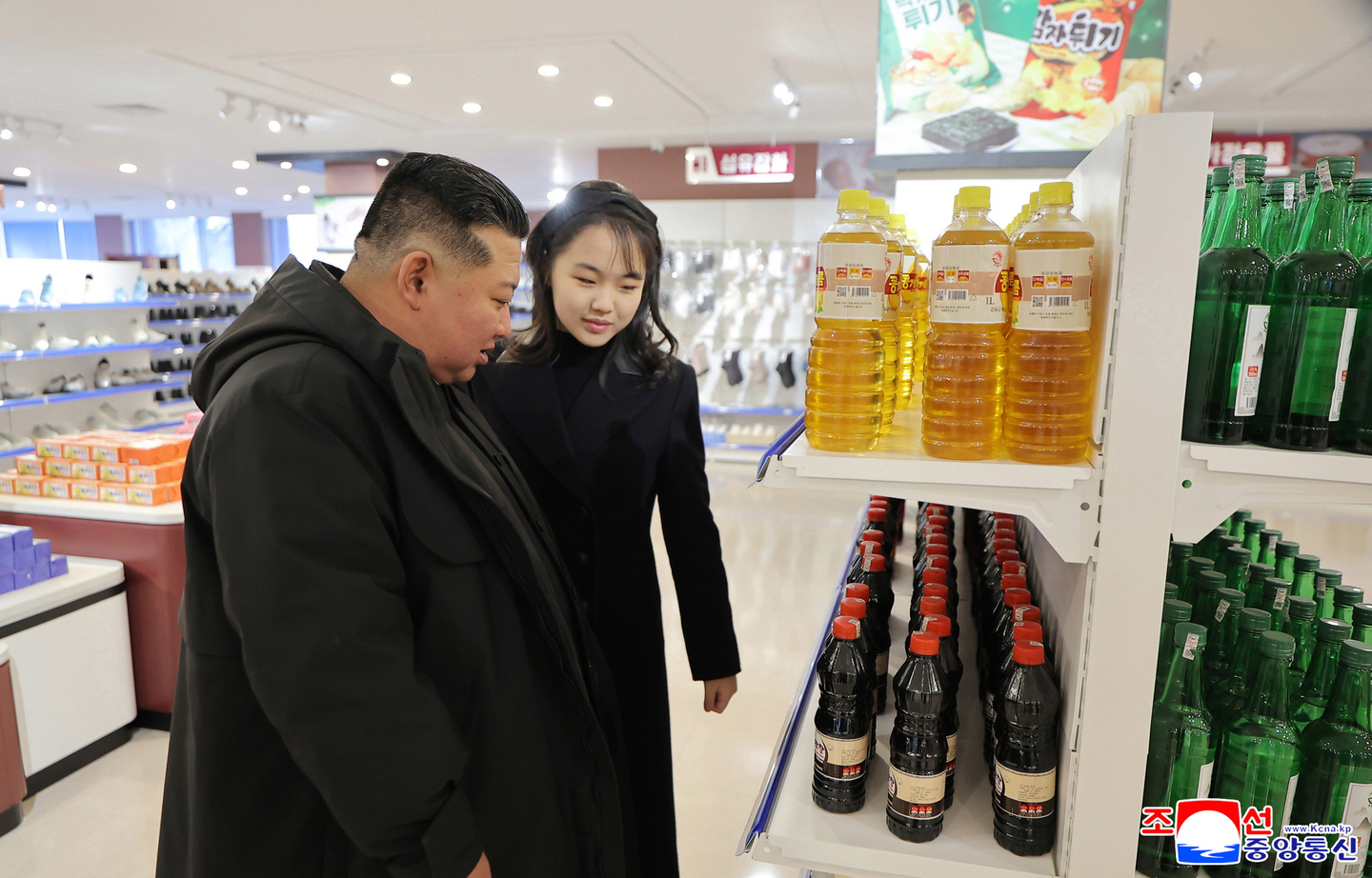 A photo released by the Korean Central News Agency on Dec. 16, 2025, shows North Korean leader Kim Jong-un, left, and his daughter, Kim Ju-ae, inspecting a recently completed industrial complex in Kangdong County on the outskirts of Pyongyang. [EPA/YONHAP]
