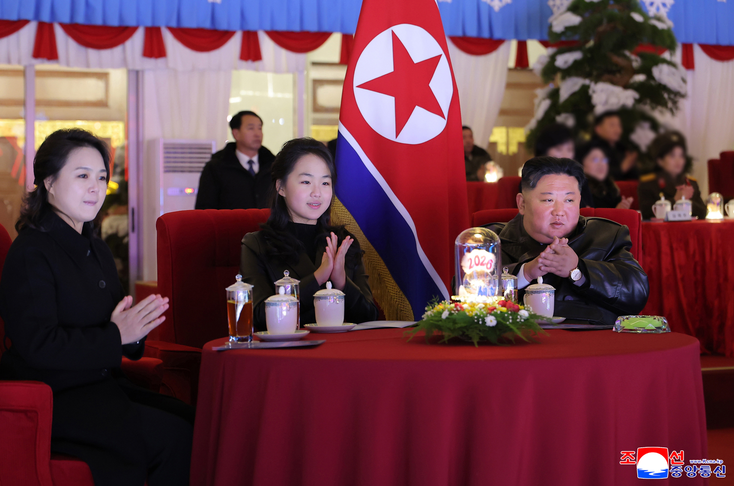 A photo released by the official North Korean Central News Agency shows North Korean leader Kim Jong-un, right, his daughter Kim Ju-ae, center, and his wife Ri Sol-ju clapping during an art performance celebrating the New Year at the May Day Stadium in Pyongyang on Jan. 1. [EPA/YONHAP]
