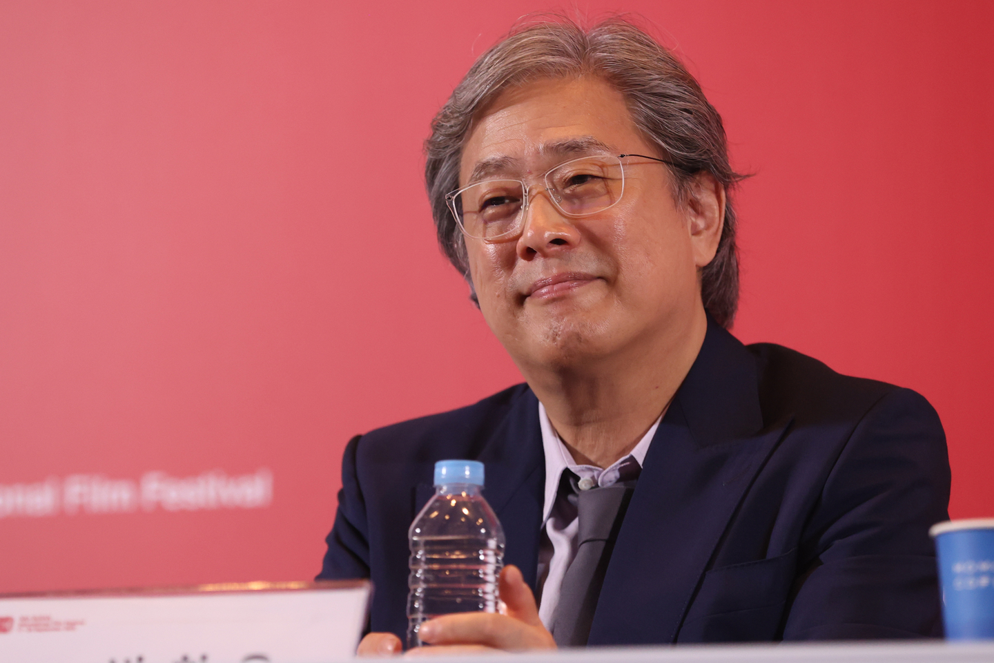Director Park Chan-wook listens during a press conference for his latest film "No Other Choice" (2025) held at the Busan Cinema Center in Haeundae District on Sept. 17, 2025. The film was selected as the opener for that year's edition of the Busan International Film Festival. [YONHAP]
