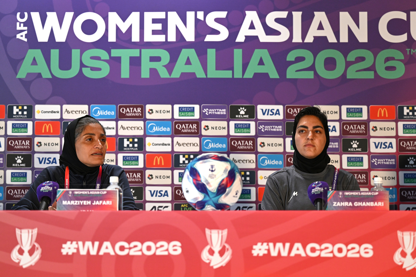 Iranian women's national football team coach Marziyeh Jafari, left, and captain Zahra Ghanbari react during a press conference ahead of their game against Korea on Monday at Robina Stadium on the Gold Coast, Australia, on March 1. [AP/YONHAP]