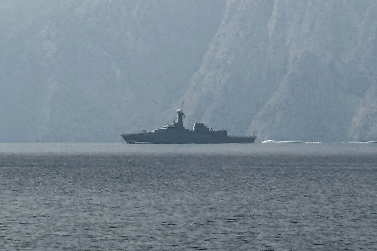 A navy vessel sails in the Strait of Hormuz, a vital waterway through which much of the world's oil and gas passes, on March 1. Two ships were attacked in the strait on March 1, maritime security agencies said, as Iran pressed a second day of strikes in response to U.S.-Israeli military strikes on Iran killing its supreme leader. [AFP/YONHAP]