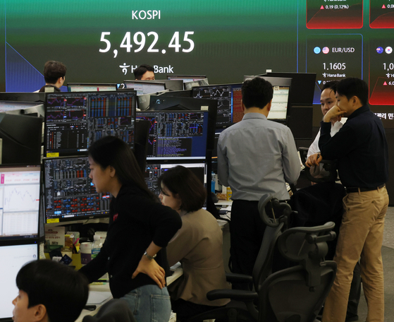 The benchmark Korea Composite Stock Price Index (Kospi) is shown on the screen inside the dealing room at Hana Bank in central Seoul on March 4, 2026. [YONHAP]