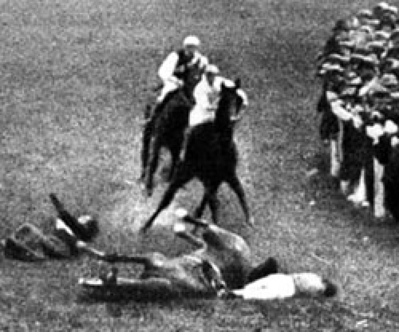 Emily Davison, left, a women’s suffrage activist, lies injured after stepping onto the track during the Epsom Derby on June 4, 1913. [WIKIPEDIA] 