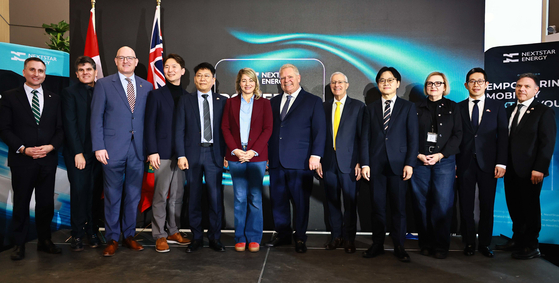 LG Energy Solution CEO Kim Dong-myung, fifth from left; Industry Minister Kim Jung-kwan, fourth from right; company representatives; and Korean and Canadian government officials take a photo at a ceremony celebrating the opening of LG Energy Solution's battery plant in Windsor, Ontario, Canada, on March 6. [LG ENERGY SOLUTION] 