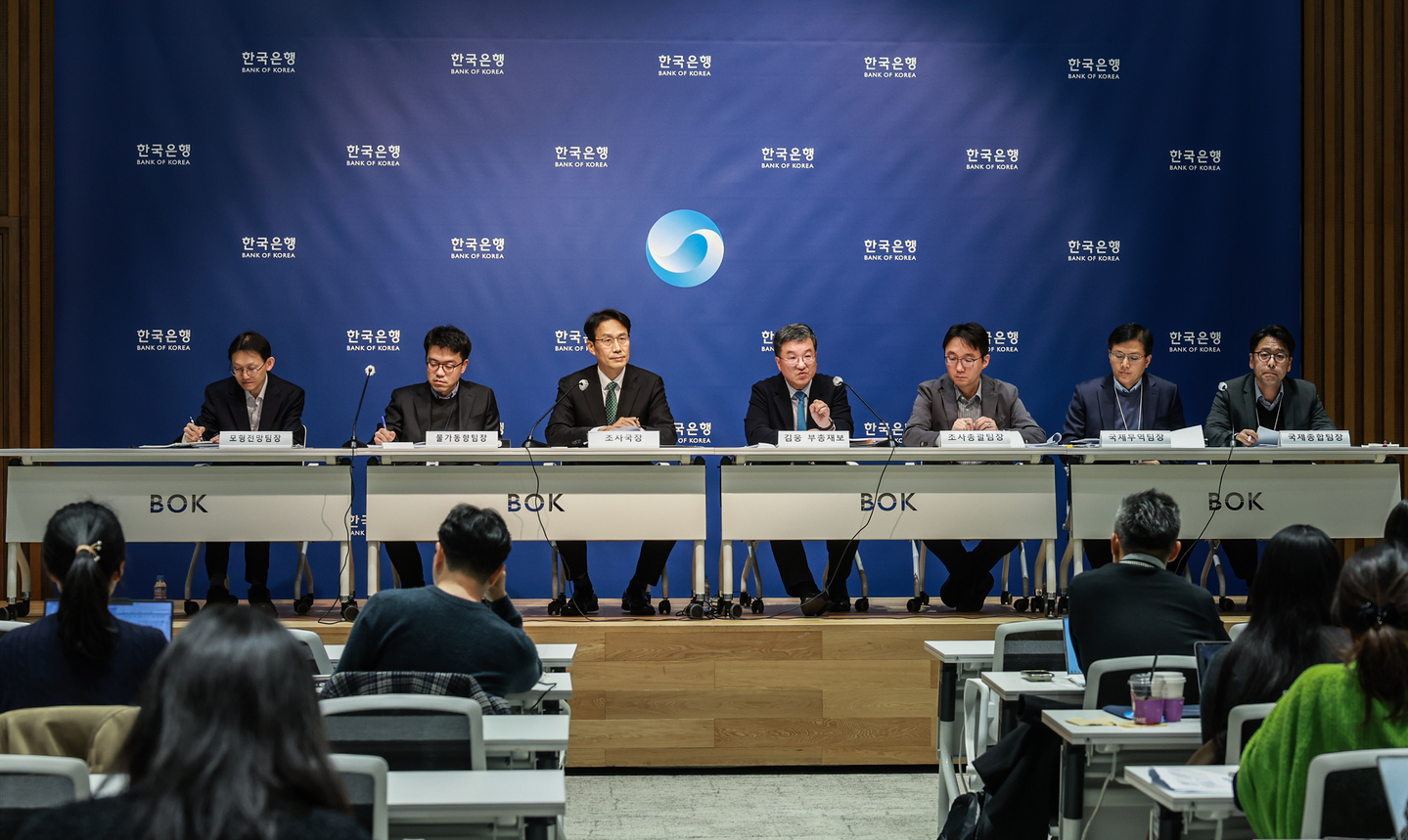 Bank of Korea (BOK) officials, including Deputy Gov. Kim Woong, fourth from left, are seen during a press conference at the BOK headquarters in Jung District, central Seoul, on Nov. 27, 2025. [BANK OF KOREA]