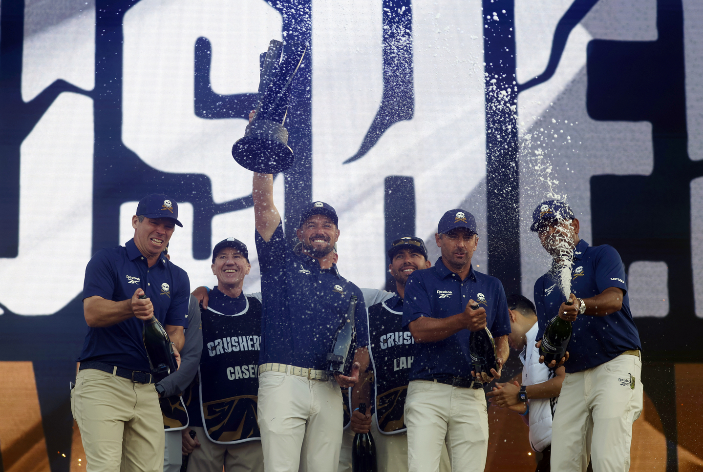 Crushers GC's Bryson DeChambeau, Charles Howell III, Anirban Lahiri and Paul Casey celebrate with their caddies after winning the the LIV Golf tournament at the Jack Nicklaus Golf Course, Incheon, on May 4, 2025. [REUTERS/YONHAP]