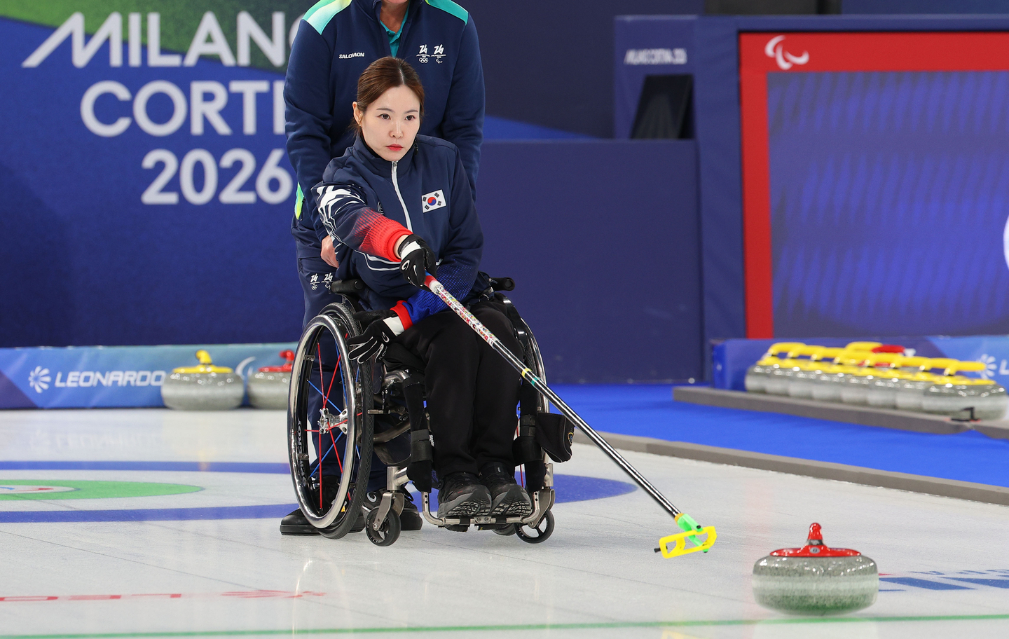 Korea’s Baek Hye-jin delivers a stone during the wheelchair curling mixed doubles semifinal against the United States at the 2026 Milan-Cortina Winter Paralympics at the Cortina Curling Olympic Stadium in Cortina, Italy, on March 10. [YONHAP]