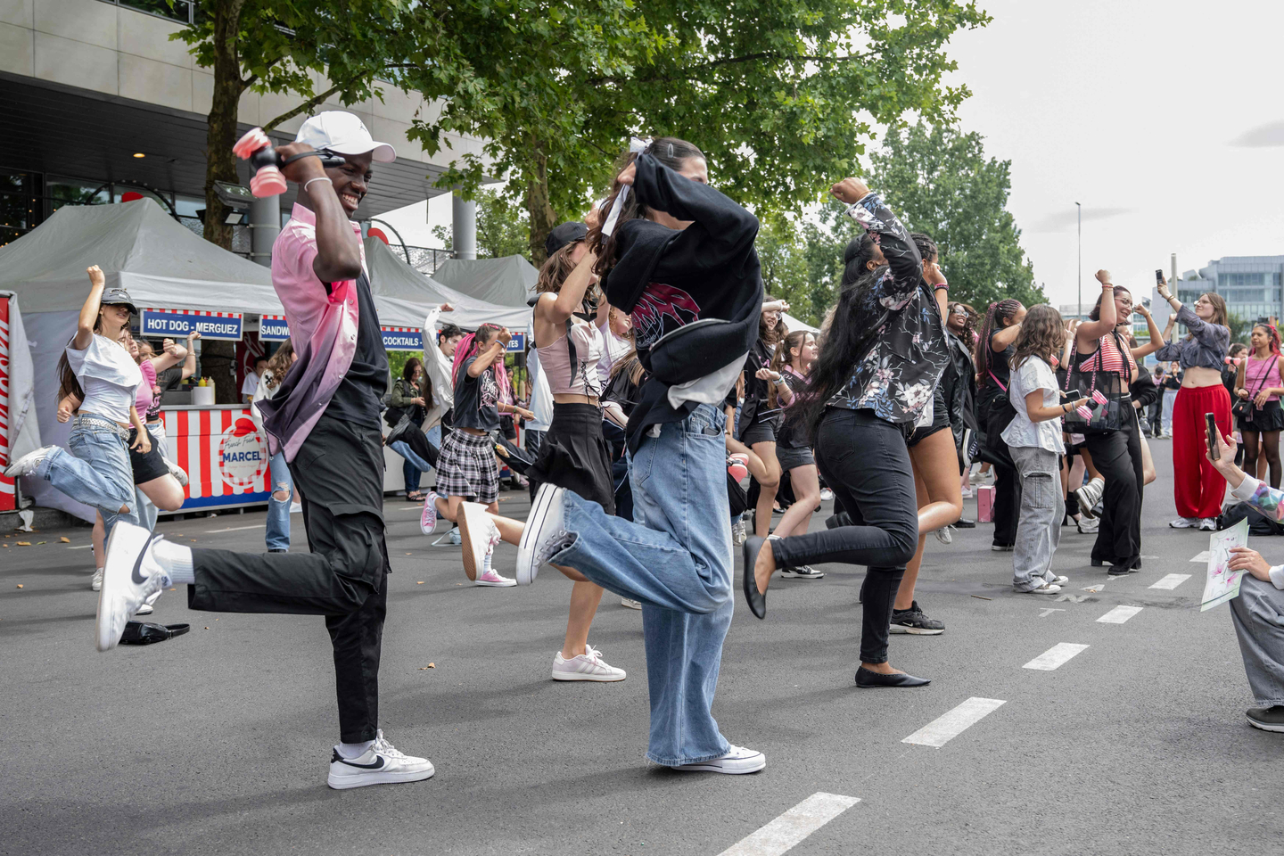 Young fans dance outside the Stade de France stadium before the concert of girl group Blackpink in Saint-Denis, in the northern outskirts of Paris, on Aug. 2, 2025. Image is unrelated to the story. [AFP/YONHAP]