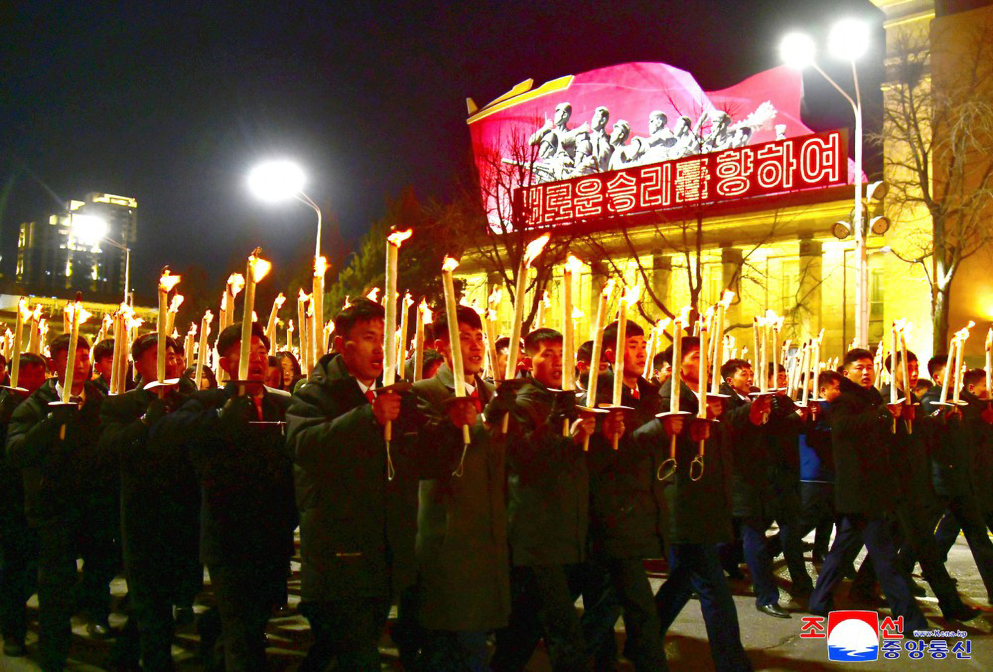 In this image provided by the Korean Central News Agency, young people and students march with torches through Pyongyang on March 10. [YONHAP]