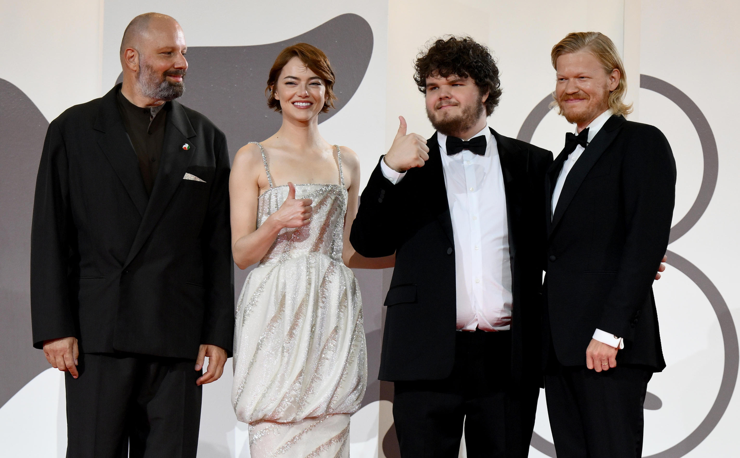 From left to right, Greek director Yorgos Lanthimos, and U.S. actors Emma Stone, Aidan Delbis, and Jesse Plemons arrive for the premiere of ″Bugonia″ during the 82nd annual Venice International Film Festival, in Venice, Italy, on Aug. 28. [EPA/YONHAP] 