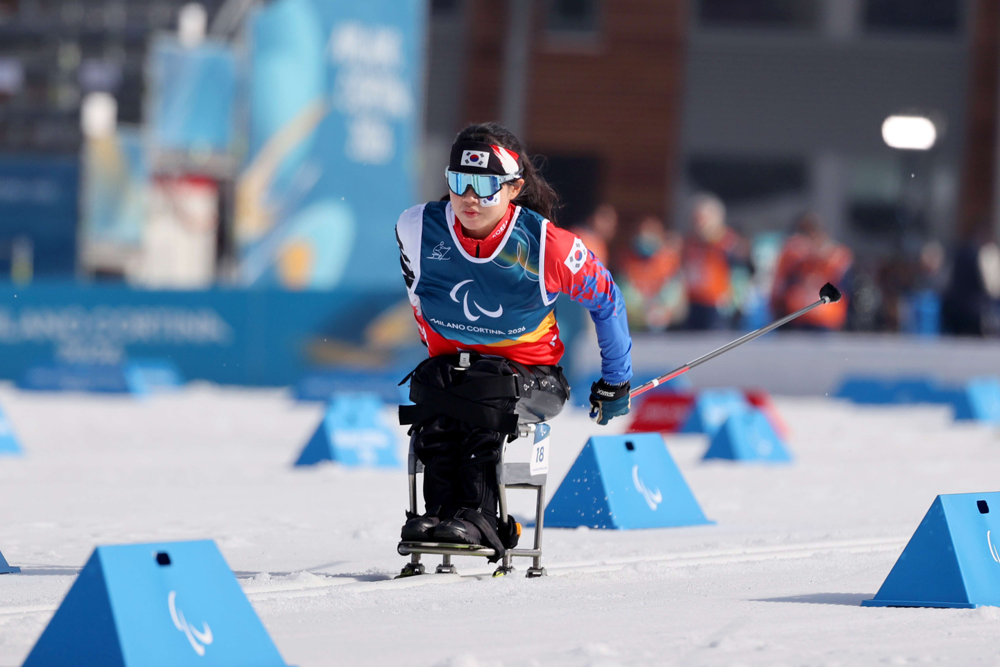 Korean para cross-country skier Kim Yun-ji races during the women's 10-kilometer interval start sitting event at the 2026 Winter Paralympics at Tesero Cross-Country Skiing Stadium in Tesero, Italy, on March 11. [YONHAP]