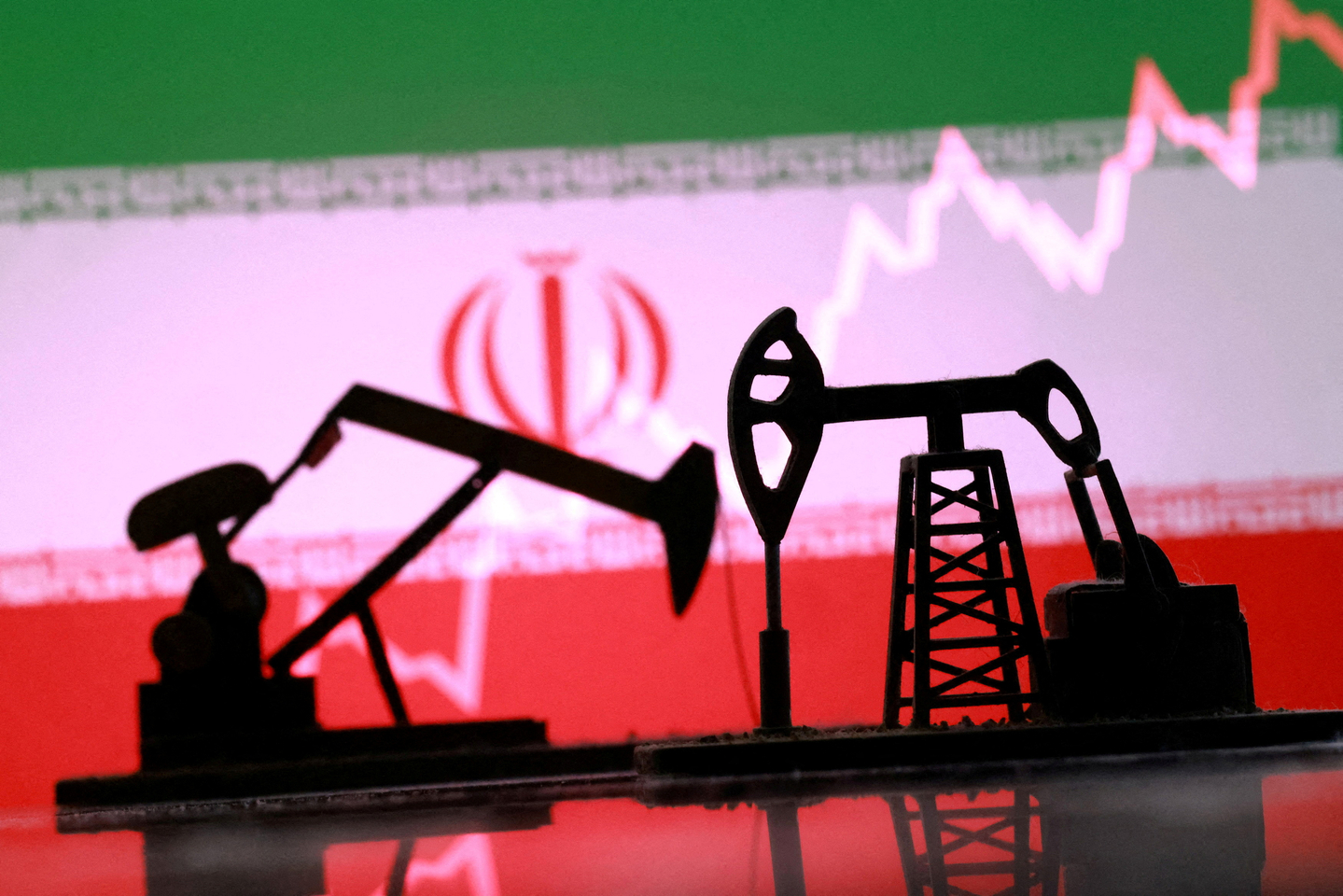 3-D-printed oil pump jacks, the Iranian flag and a rising stock graph appear in this illustration from March 2. [REUTERS/YONHAP]