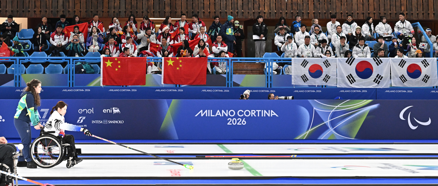 Korea’s Baek Hye-jin delivers a stone during the wheelchair curling mixed doubles final against China at the 2026 Milan-Cortina Winter Paralympics at the Cortina Curling Olympic Stadium in Cortina, Italy, on March 11. [YONHAP]