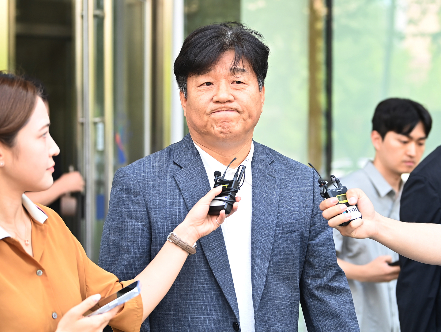Democratic Party Rep. Yang Moon-seok walks out of the Suwon High Court in the city just south of Seoul on July 24, 2025, after the appellate court upheld a sentence of 18 months in prison, suspended for three years for Yang on charges of fraud. [YONHAP] 
