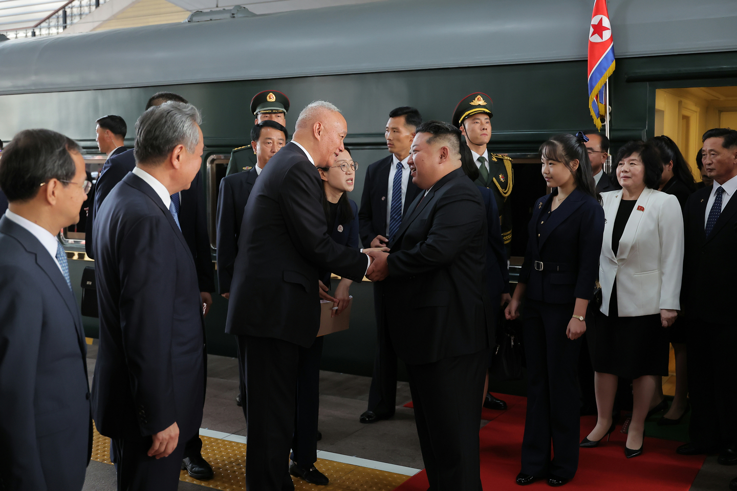 North Korean leader Kim Jong-un, fourth from right, and his daughter, third from right, are greeted by Chinese officials as they step off their train in Beijing on Sept. 2, 2025, in this photo released by Pyongyang's official Korean Central News Agency. [YONHAP]