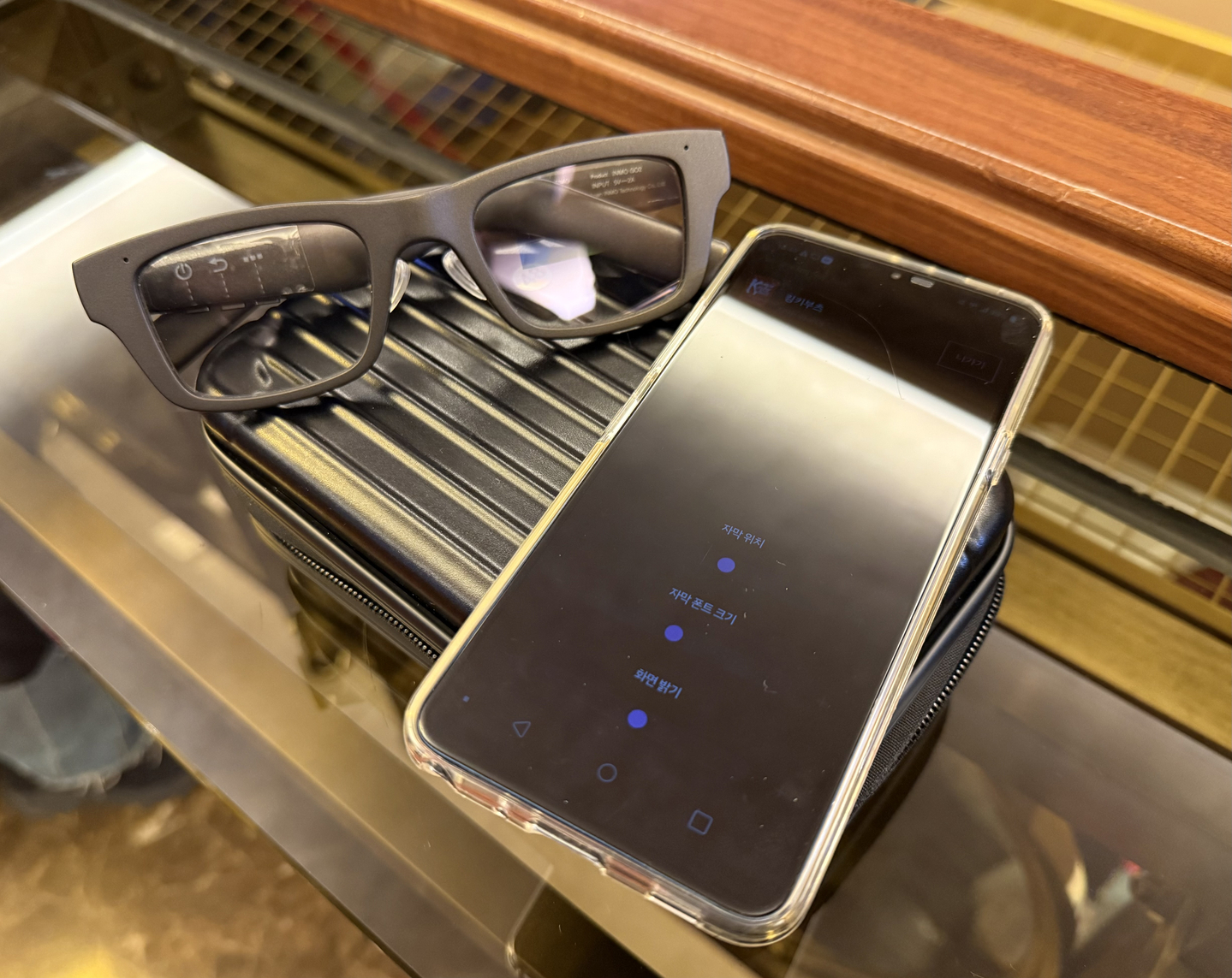 “Owl” subtitle glasses made by XpertINC are shown connected to an audience member's cellphone during a "Kinky Boots" performance. [LEE JI-YOUNG]