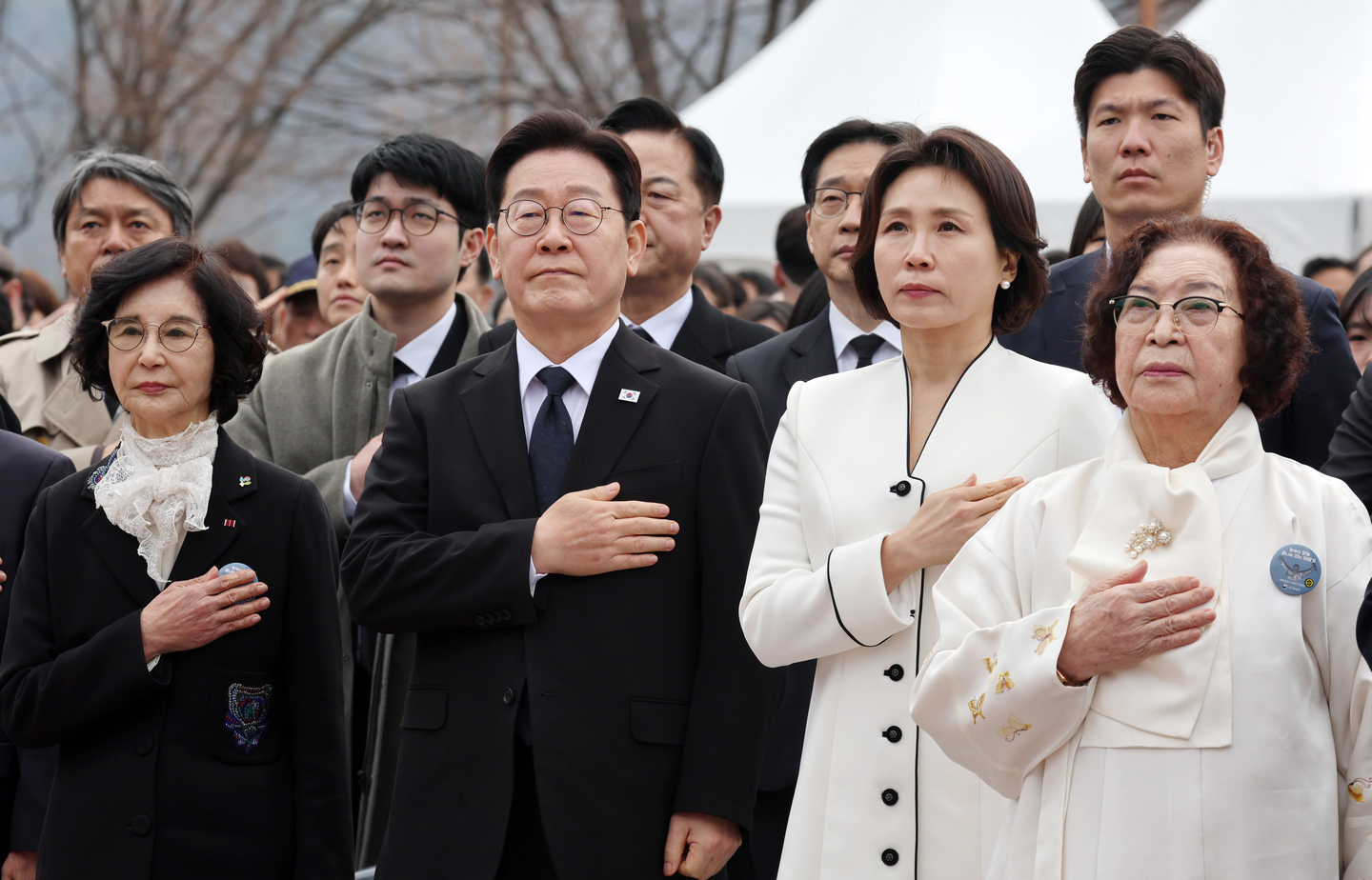 President Lee Jae Myung and first lady Kim Hye-kyung salute the national flag during a ceremony marking the 66th anniversary of the March 15 Uprising at the National 3·15 Democracy Cemetery in Changwon, South Gyeongsang, on March 15. [JOINT PRESS CORPS]