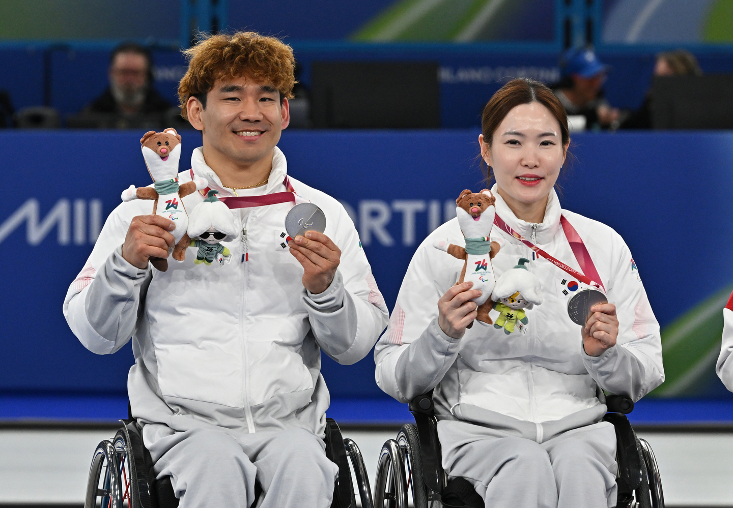 Baek Hye-jin, right, and Lee Yong-suk pose after winning a silver medal in the mixed doubles curling event at the 2026 Milan-Cortina Winter Paralympics in Italy on March 11. [NEWS1] 