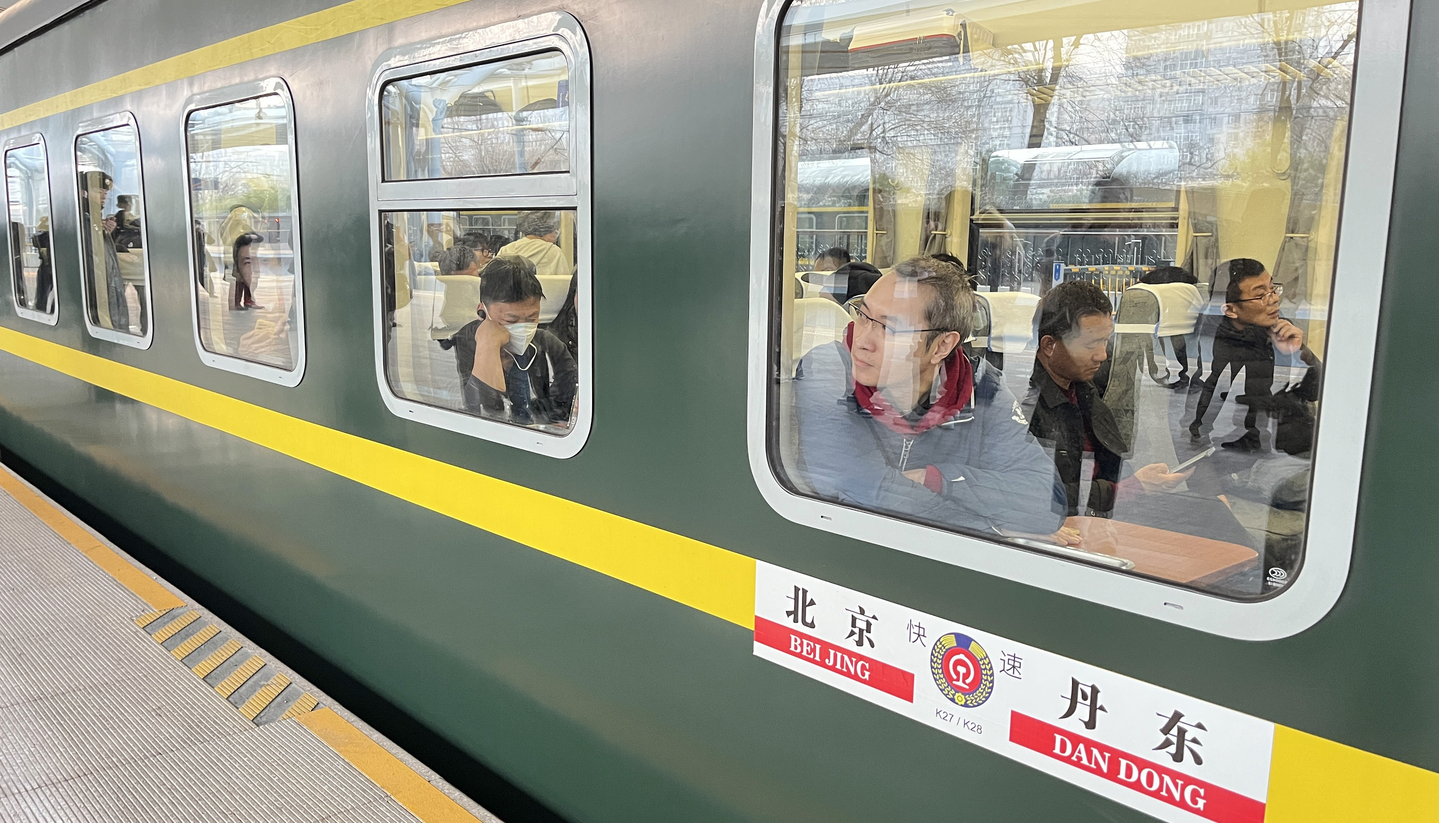 A passenger train bound for Pyongyang departs from Beijing Station on March 12, as North Korea and China resumed passenger train services for the first time in six years. [YONHAP]
