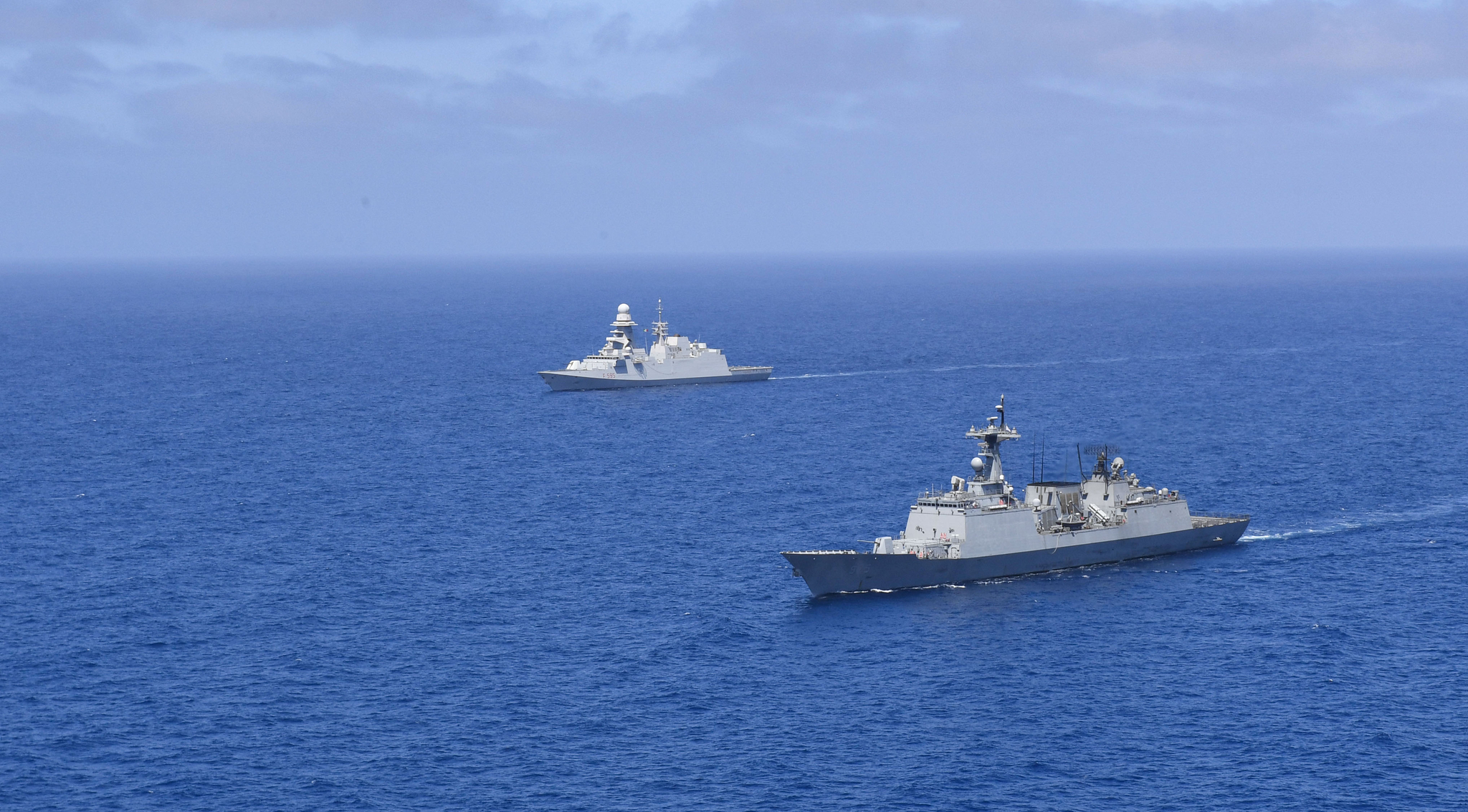 The Cheonghae unit's Chungmugong Yi Sun-shin destroyer, right, alongside the Italian frigate Luigi Rizzo, participates in a counter-piracy operation codenamed ″Hanul″ in waters near the Gulf of Aden on May 21, 2023. [JOINT CHIEFS OF STAFF]