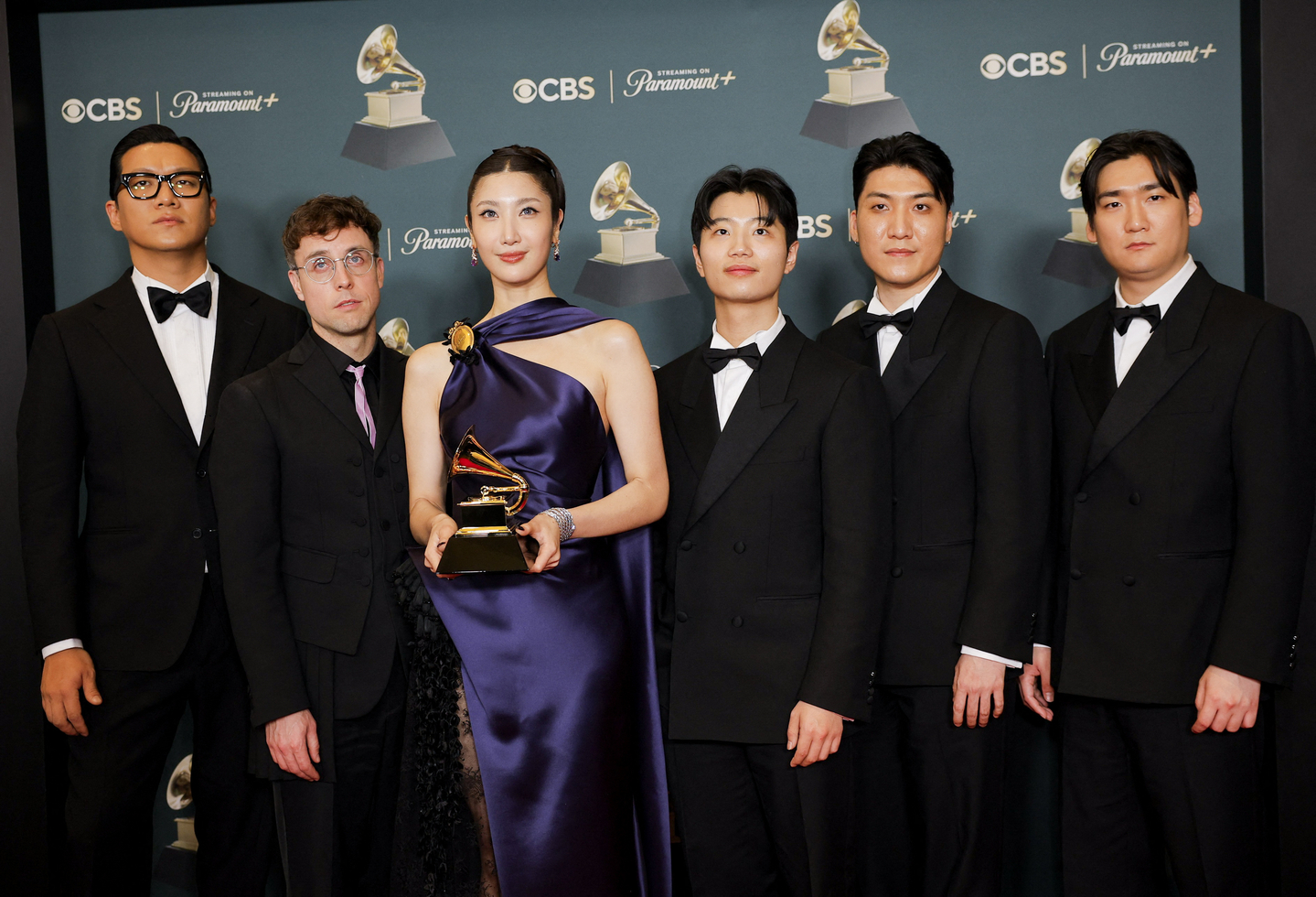 The producers of the soundtrack for ″KPop Demon Hunters″ (2025) pose with the Best Song Written For Visual Media award for ″Golden″ during the 68th Grammy Awards in Los Angeles, California, Feb. 1. [REUTERS/YONHAP]