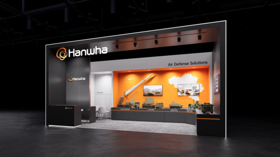 A render of Hanwha Aerospace and Hanwha Systems' booth at the Brussels European Defence Exhibition 2026. [HANWHA]