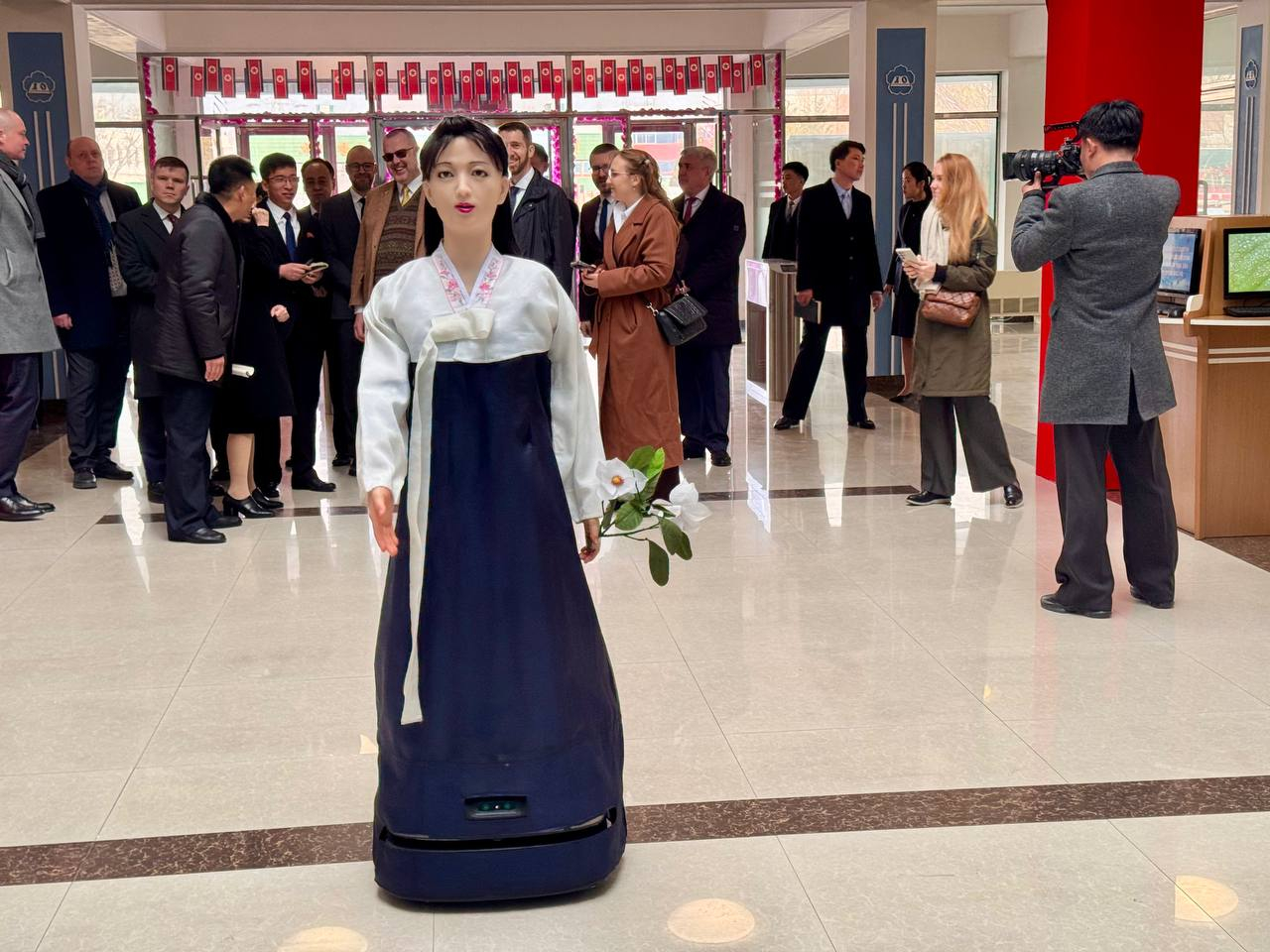 A guide robot dressed in hanbok (traditional Korean dress) welcomes voters and explains the voting process at a polling station set up at the library of Pyongyang Teachers Training College during North Korea’s Supreme People’s Assembly election on March 15, in this image shared by the Russian Embassy in North Korea. [YONHAP]