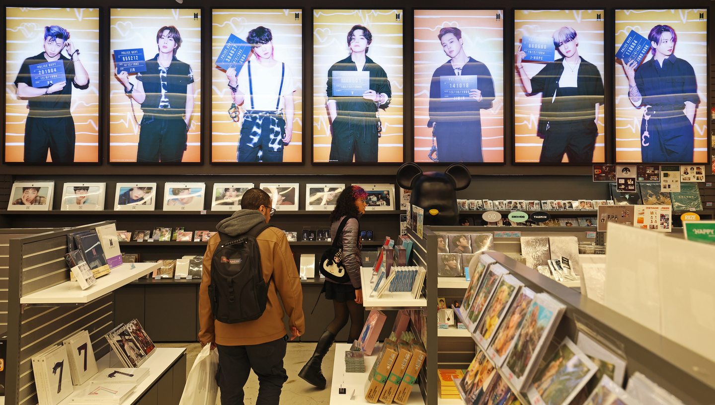 Posters of K-pop group BTS cover the walls of a store in central Seoul on March 19, where a wide range of BTS albums and merchandise are sold to fans ahead of the group’s comeback performance at Gwanghwamun Square on March 21. [NEWS1]