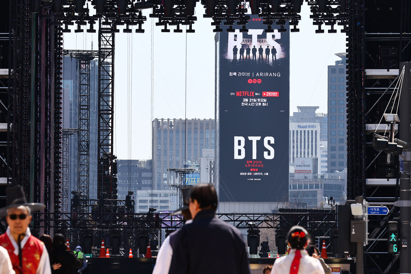 An advertisement promoting BTS’s upcoming comeback performance is displayed on a screen near Gwanghwamun Square in Jongno District, central Seoul, on March 19, two days ahead of the show. [KIM JONG-HO]