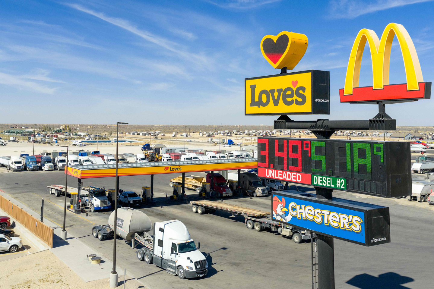 In an aerial view, gas and diesel prices are displayed at a Love's Travel Stop on March 17, in Kermit, Texas. Diesel prices have surged past $5 per gallon as attacks on energy infrastructure and fuel exports intensify amid the ongoing conflict involving Iran, Israeli forces, and the United States. [AFP/YONHAP]