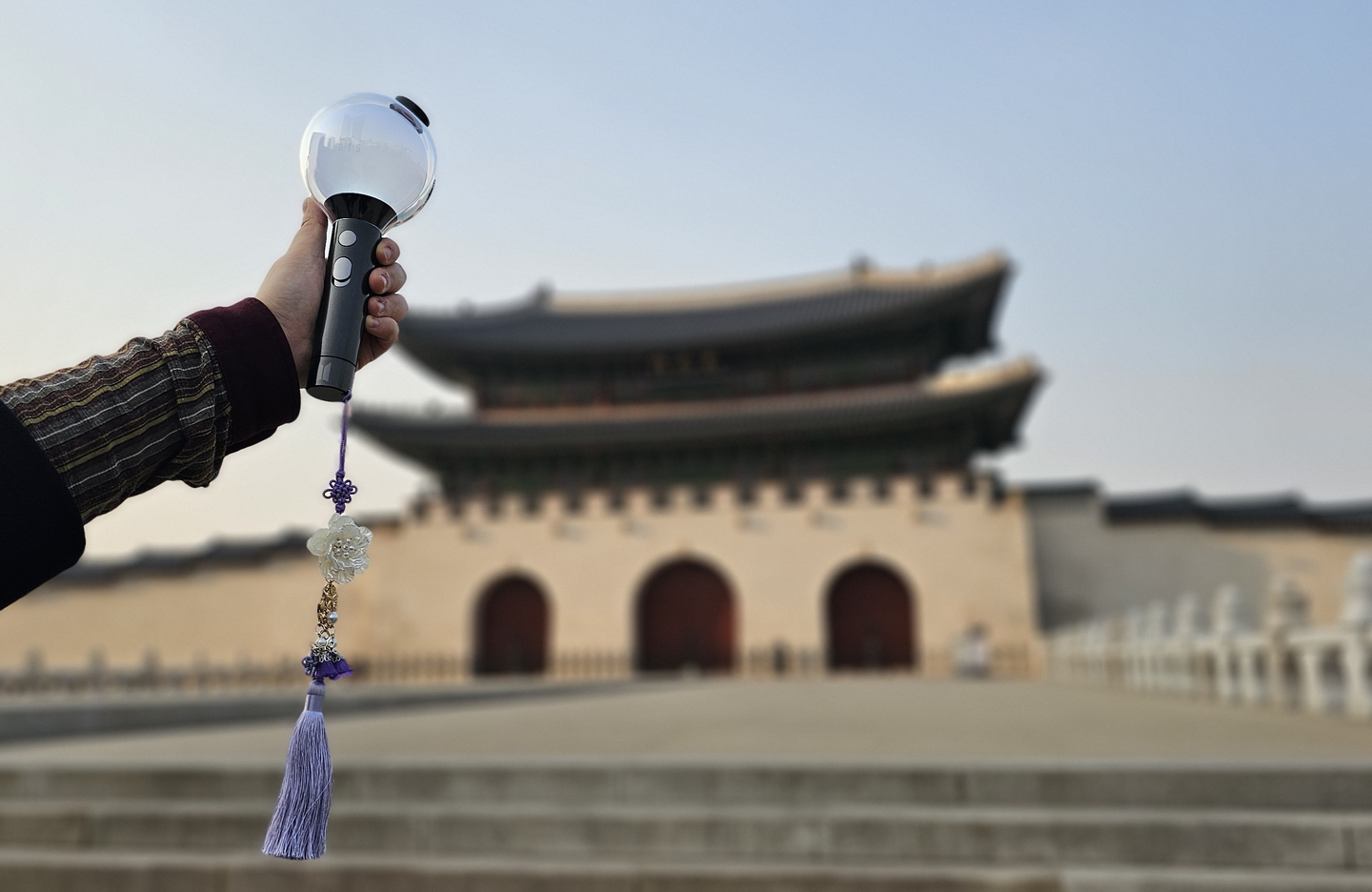 An ARMY Bomb light stick with a handmade "norigae," a traditional Korean tassel, is seen in front of Gwanghwamun in Jongno District, central Seoul, on March 17. [SHIN HA-NEE]