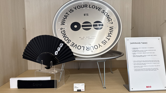A fan and a silver Arirang table for sale at the BTS pop-up store held on the fourth floor of The Heritage at Shinsegae The Main in Jung District, central Seoul. [WOO JI-WON]